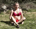 Sissy in red bikini outside