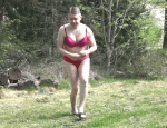 Sissy in red bikini outside